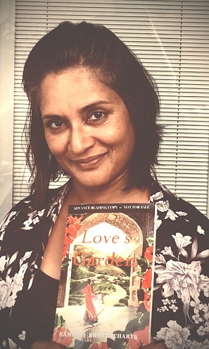 Holding the first print copy of my debut novel, Love's Garden